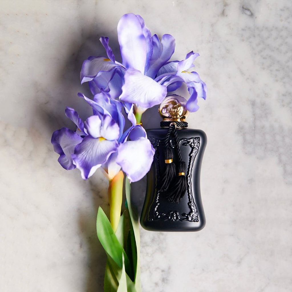 Athalia by Parfums de Marly, 75ml bottle displayed beside fresh purple irises