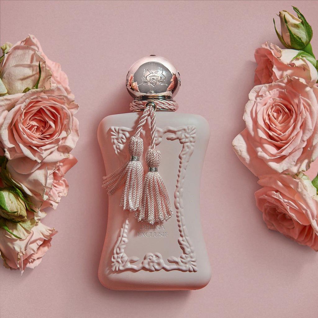 Delina Exclusif by Parfums de Marly, 75ml blush pink bottle styled with pink roses