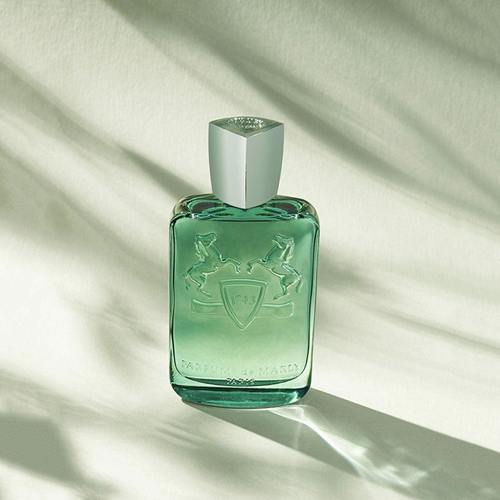 Greenley by Parfums de Marly, 125ml green bottle in sunlight with leaf shadow effect