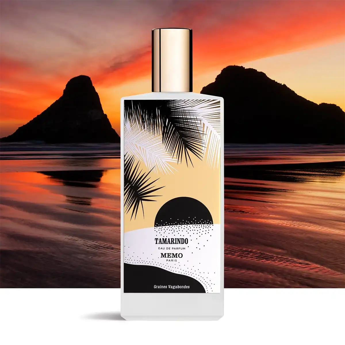 Tamarindo Eau de Parfum by Memo Paris, 75ml bottle shown with tropical sunset background