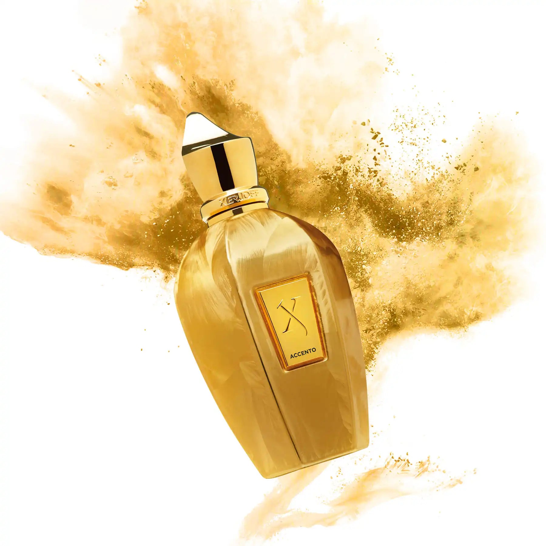 Accento Overdose perfume bottle surrounded by a burst of golden powder, highlighting its luxurious design.