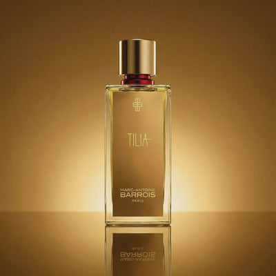 Marc-Antoine Barrois Tilia Eau de Parfum bottle on a warm gold background, shown in a short rotating animation
