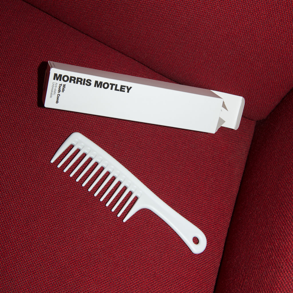 Morris Motley Wide Tooth Comb Hair Styling Tool and Box on Red Couch